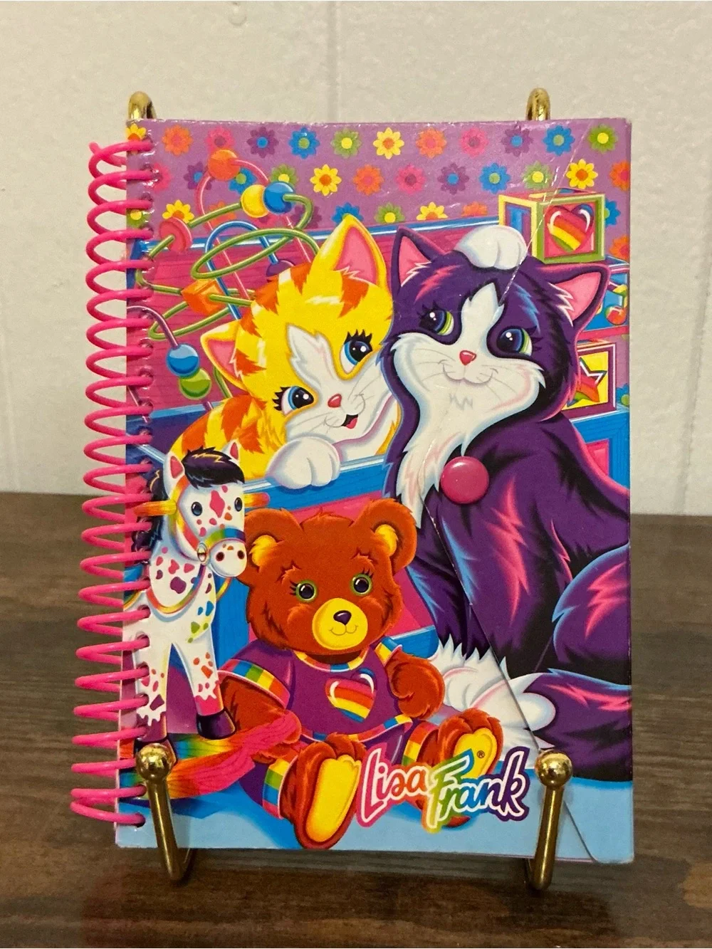 A vintage 1990s Lisa Frank snap mini notebook features colorful Playtime Kittens